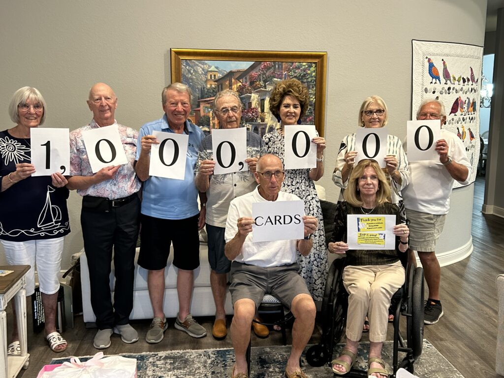 A group of people holding up signs with numbers 0 through 0.